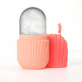 Silicone ice face roller in pastel peach with a textured grip, shown with a matching removable cap against white.