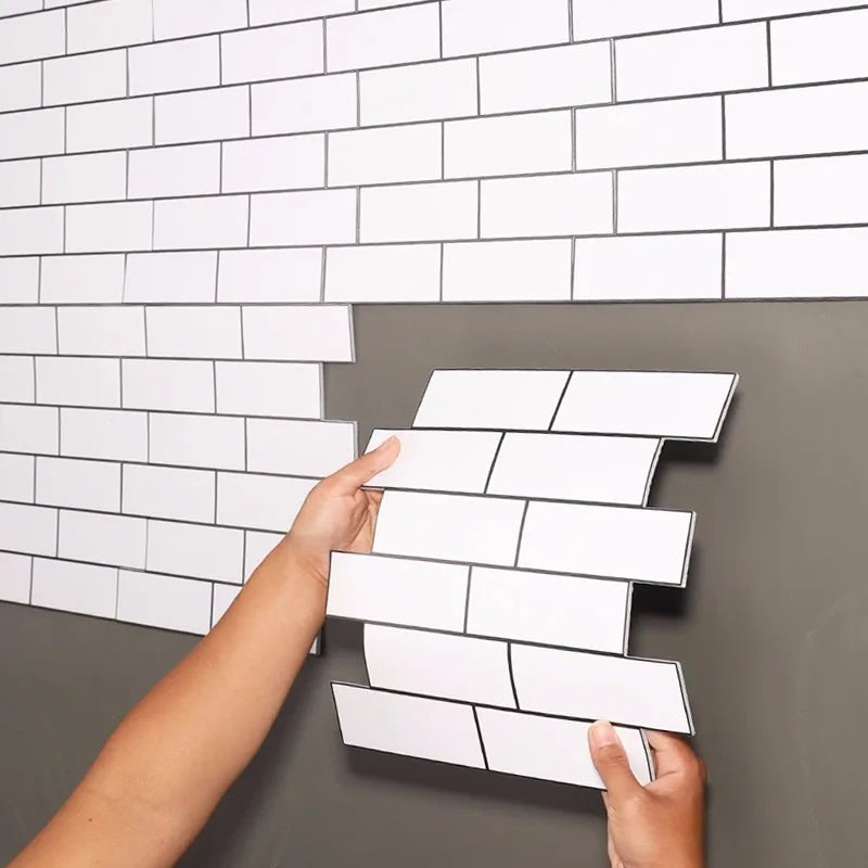 White peel-and-stick brick-style backsplash tile sheet in staggered rows