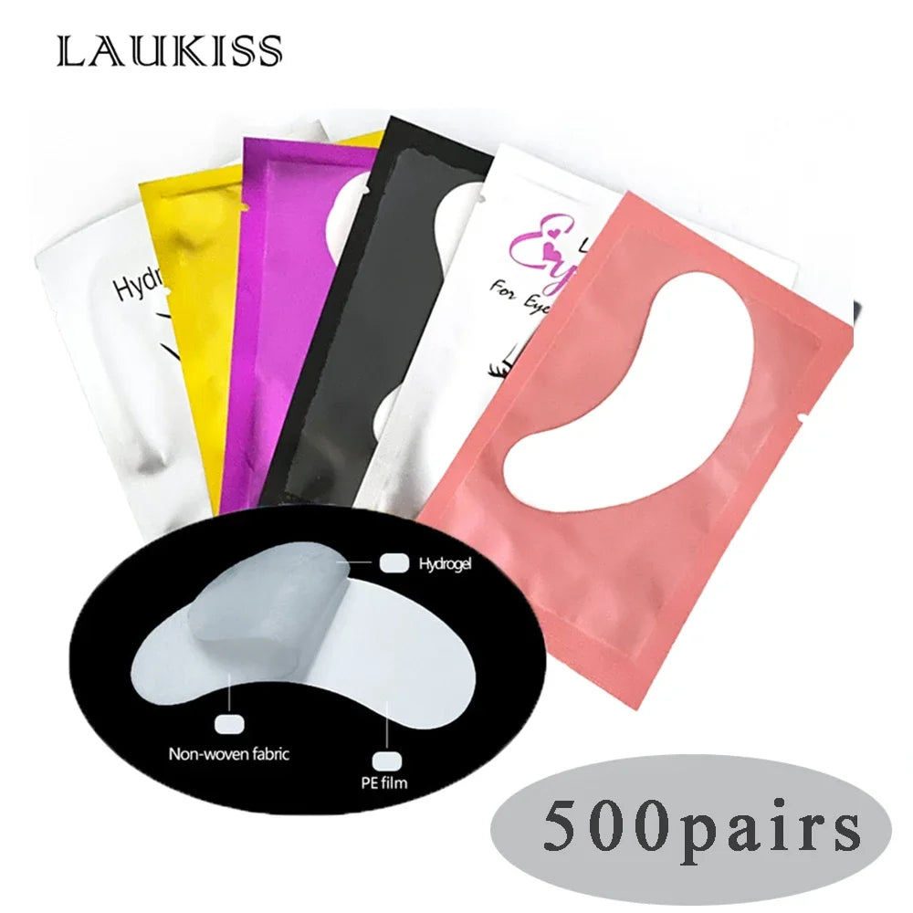 Colorful hydrogel under-eye pads in foil sachets for eyelash extensions, featuring non-woven fabric and PE film layers.