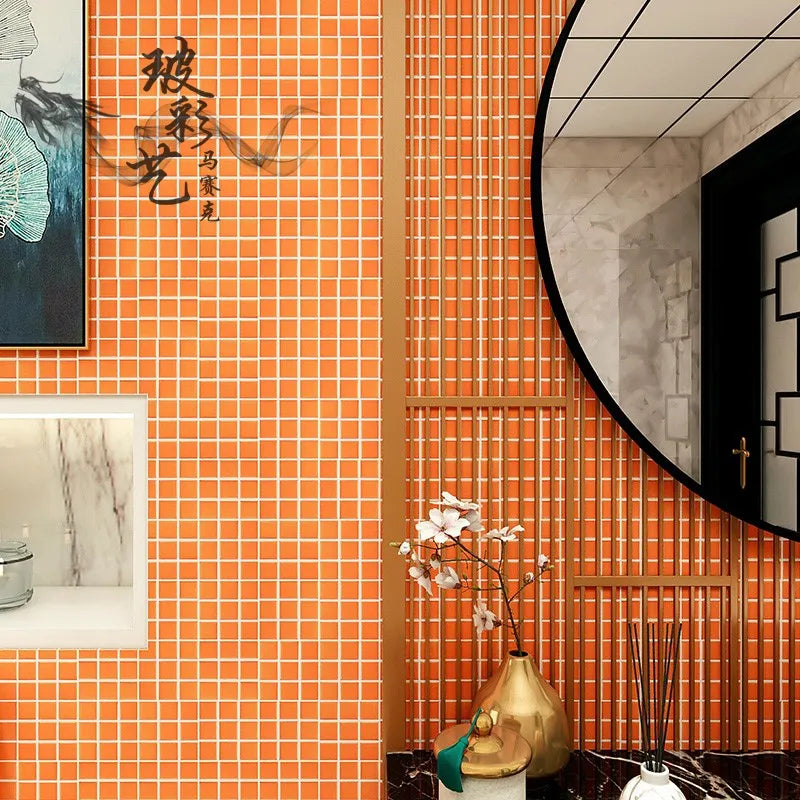 Ceramic mosaic wall tiles in orange square grid pattern for bathroom accents.
