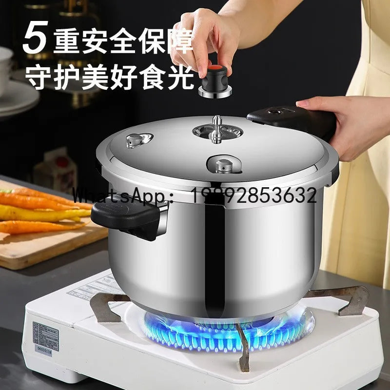 Stainless steel pressure cooker on electric hot plate with blue heat and lid valve