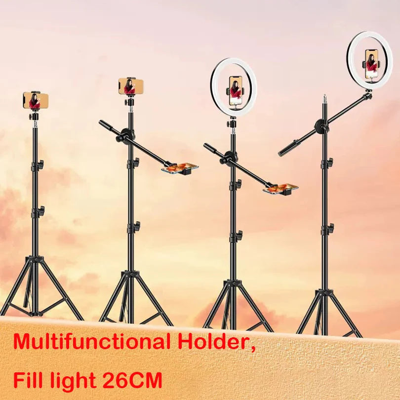 Black metal floor tripod with adjustable boom arm and 26cm circular ring light for smartphone recording and lighting.