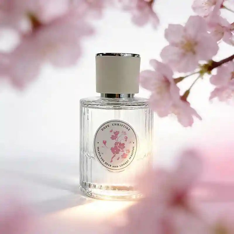 Hope Christine Sakura floral perfume for women in a ribbed glass bottle with cherry blossom notes. Long-lasting scent.