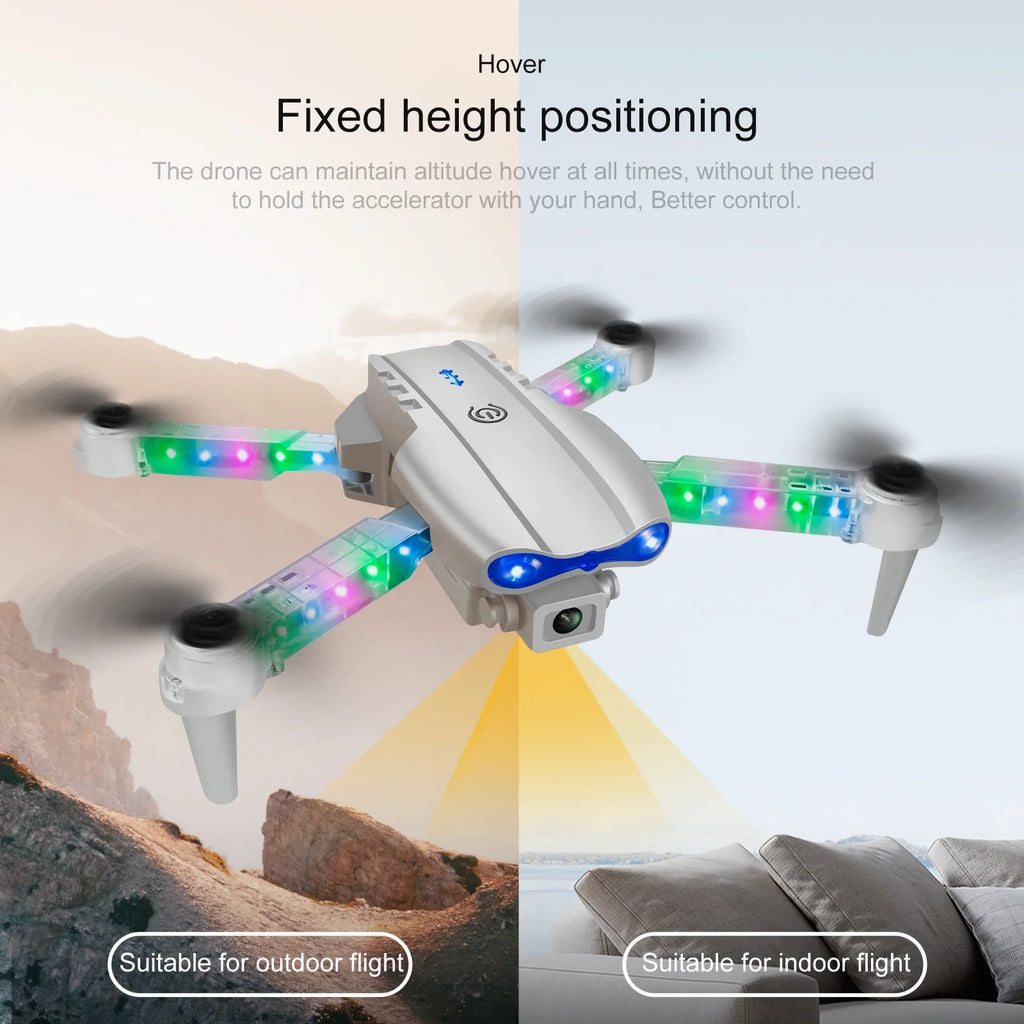 Silver quadcopter drone with colorful LED lights on arms, front camera, and altitude hover for indoor or outdoor flight.
