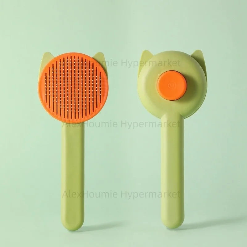 Green and orange self-cleaning cat grooming brush for easy shedding and hair removal for kittens and puppies.
