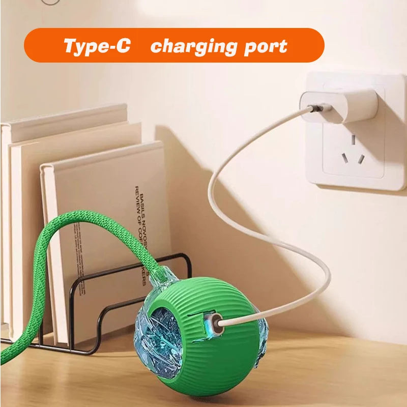 Rechargeable smart interactive cat ball toy with Type-C charging port for automatic rolling play, green design.