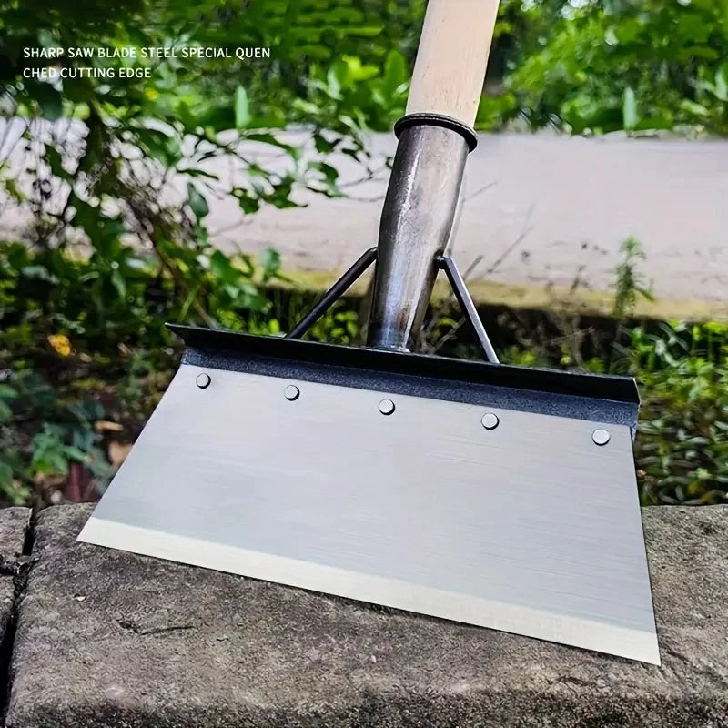 Garden edging shovel with silver blade and dark steel tube handle on stone