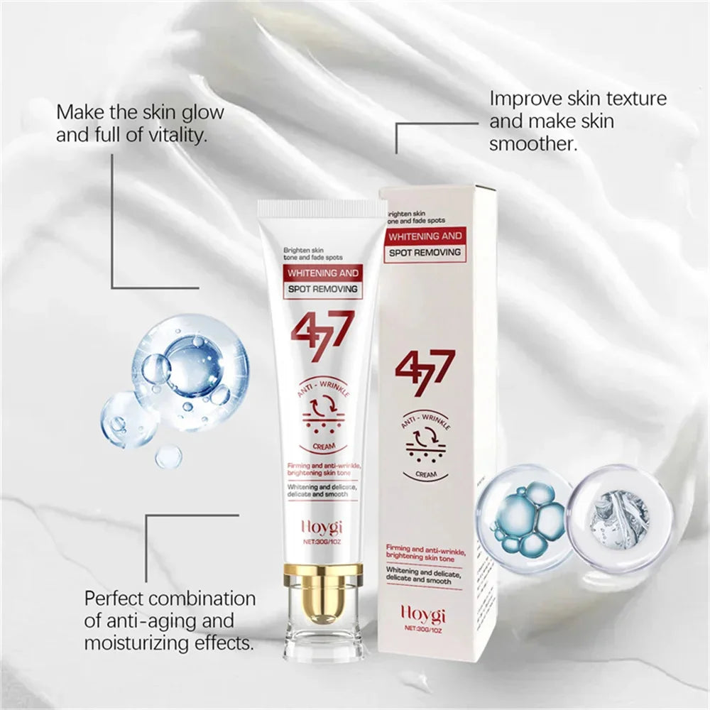 Hoygi spot-removing whitening cream in a white squeeze tube and box against a white cream texture background.