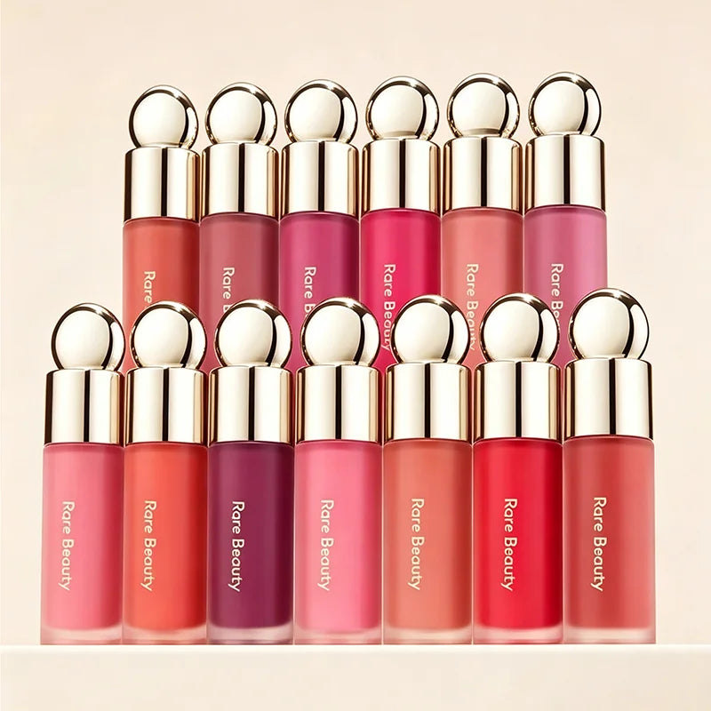 Rare Beauty matte liquid lipsticks in diverse, rich colors with gold caps in a smooth, elegant, long-wear makeup collection.