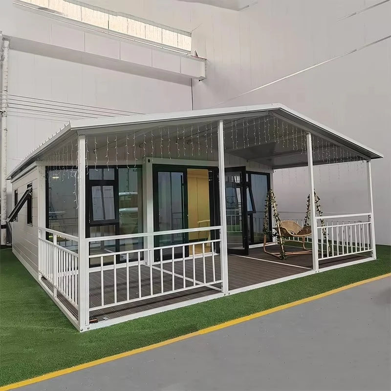 Modern prefab container house with glass enclosure and white balcony railing