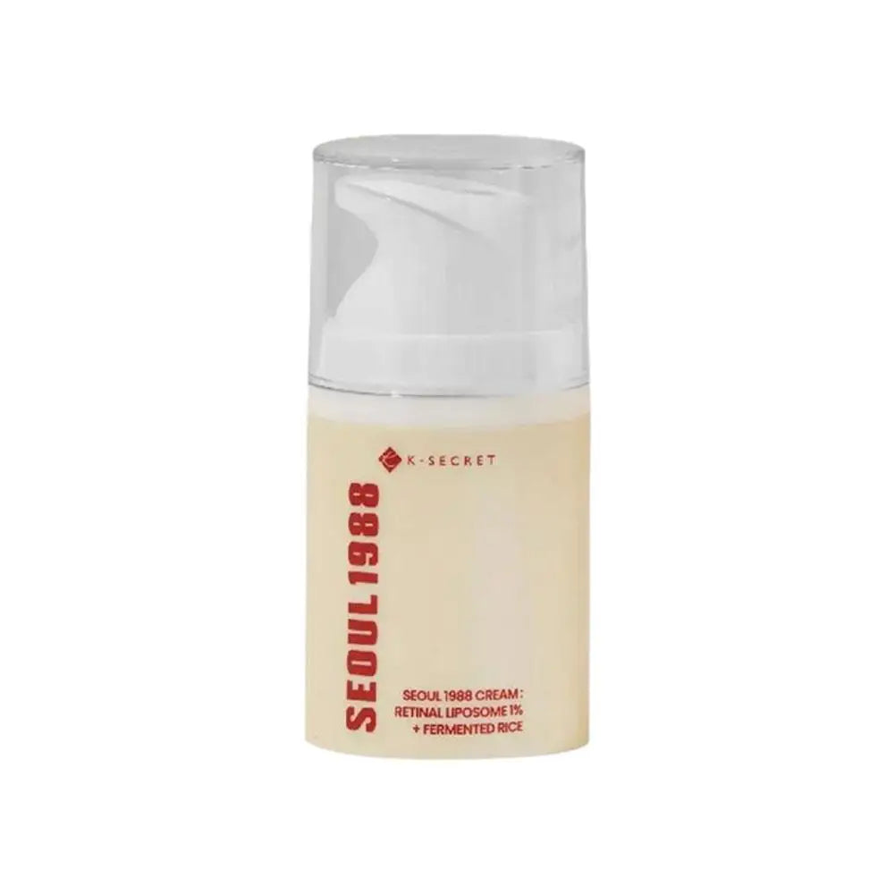 K-Secret retin(al) serum bottle with clear pump cap, pale cream liquid and red label