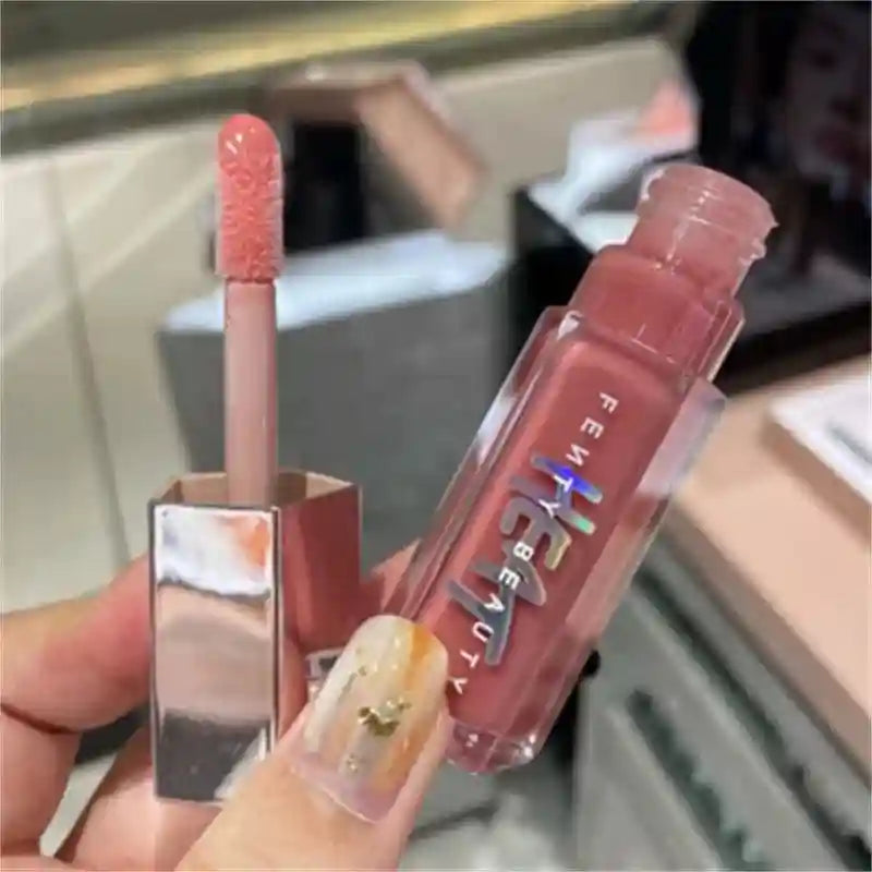 Tidesmit Fenty Beauty transparent glitter lip plumper liquid lipstick showing shimmering multicolor texture details