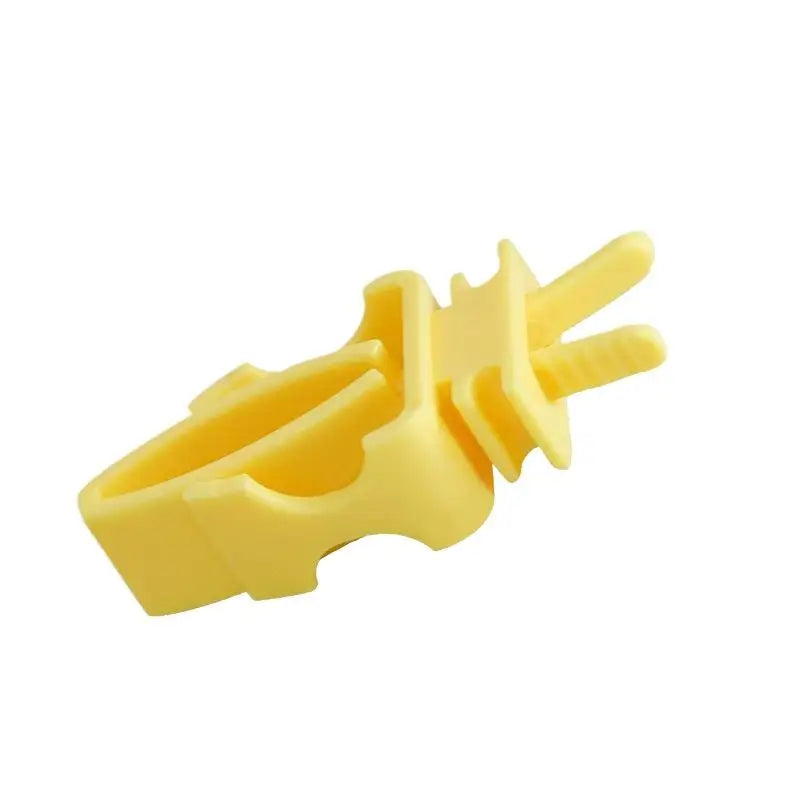 Yellow plastic bird cage food holder clip for fruits, vegetables, and cuttlefish bone feeding.