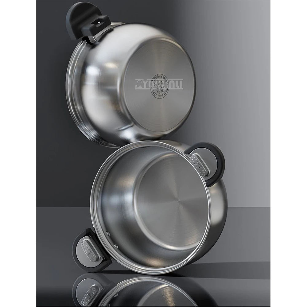 Stainless steel pressure cooker with lid opened, showing interior and base pot
