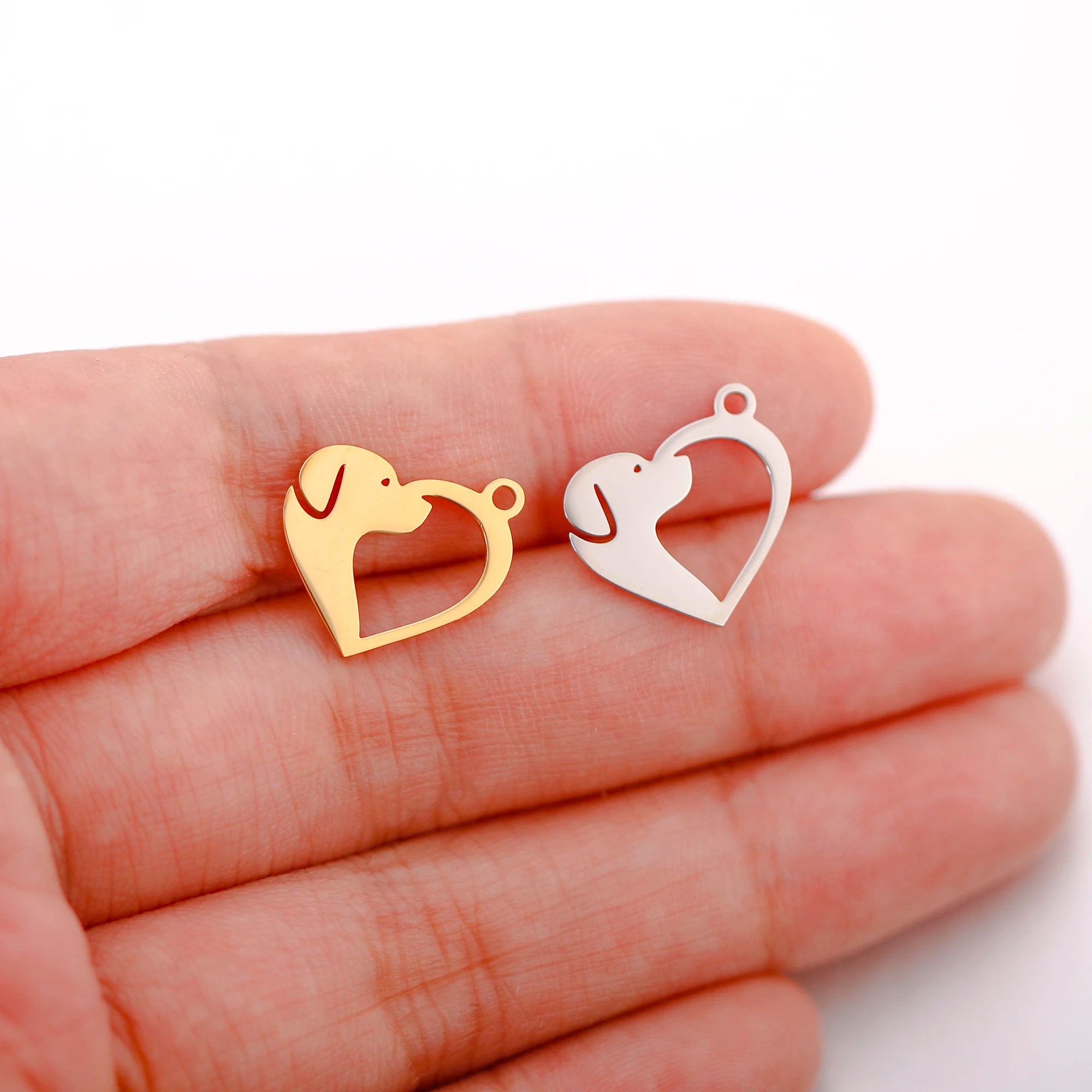 Gold and silver heart-shaped dog charms for DIY jewelry making, crafting personalized pet-themed necklaces and bracelets.