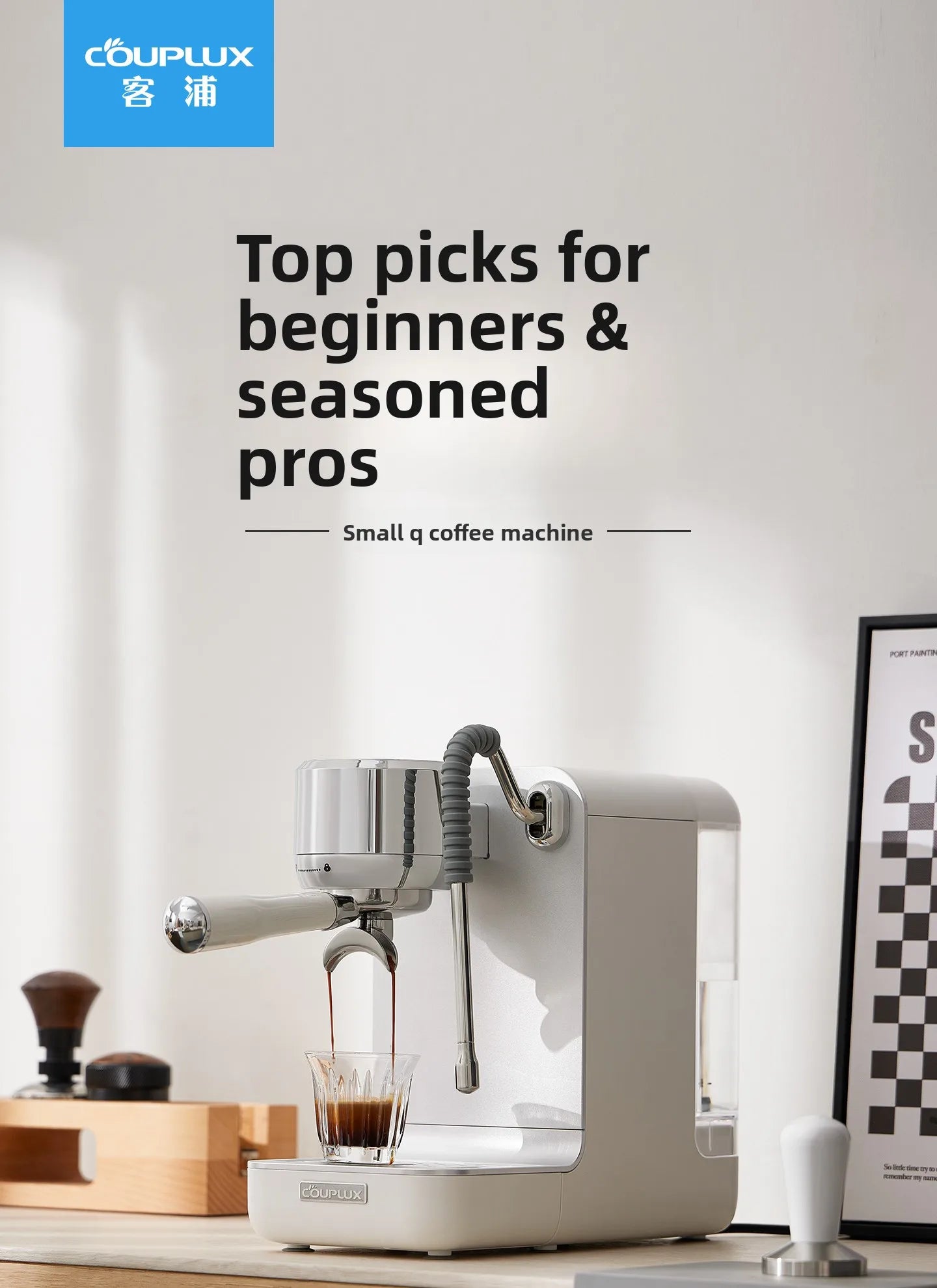 Couplux Small Q compact espresso machine in matte white, brewing coffee into a glass cup with chrome accents.