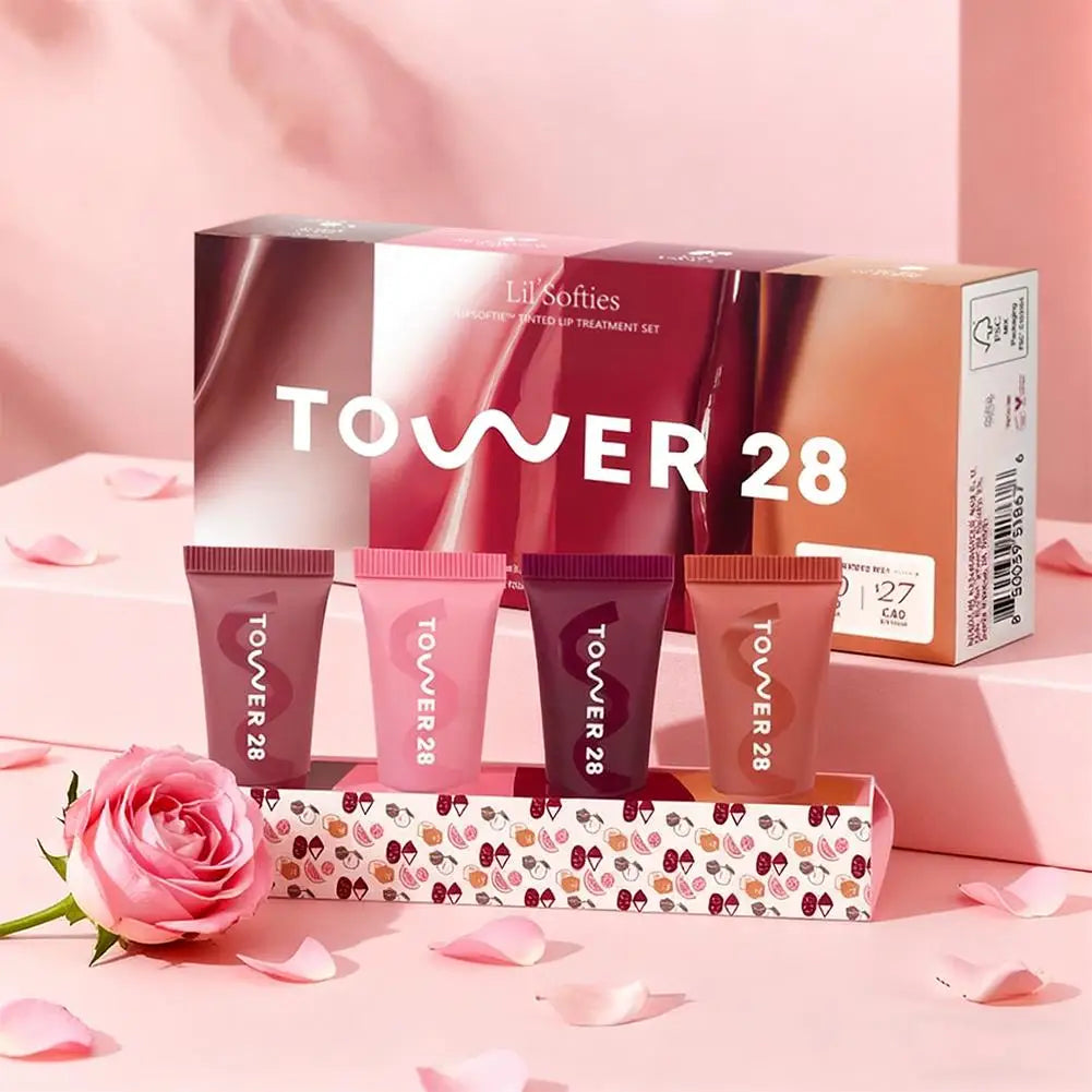 Tower 28 4-piece Lil’ Softies tinted lip balm set in varied pink and berry shades with a hydrated, mirror-shine finish.