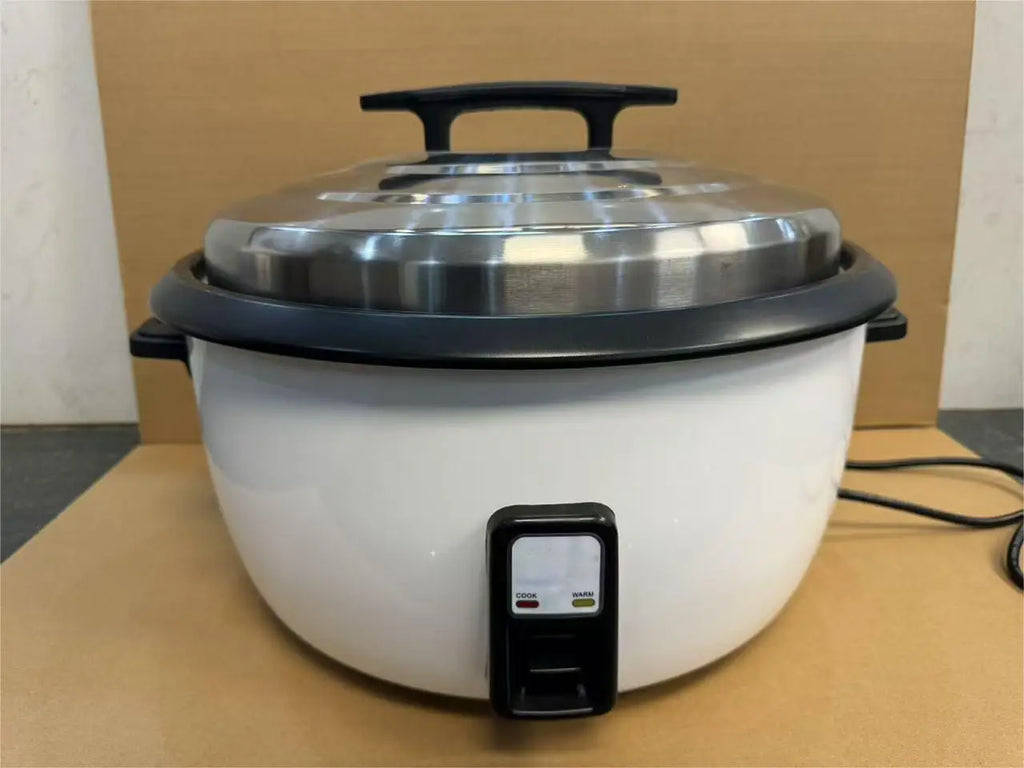 Commercial rice cooker on countertop with black control base and stainless lid
