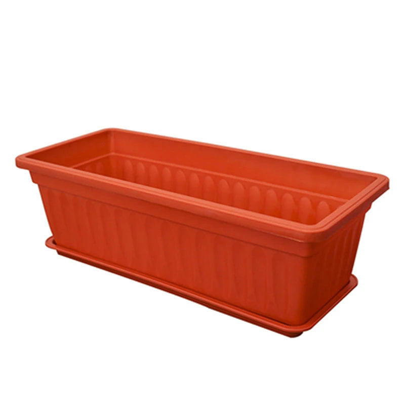 Rectangular plastic planter box with drainage slots, orange pot for balcony or indoor plants