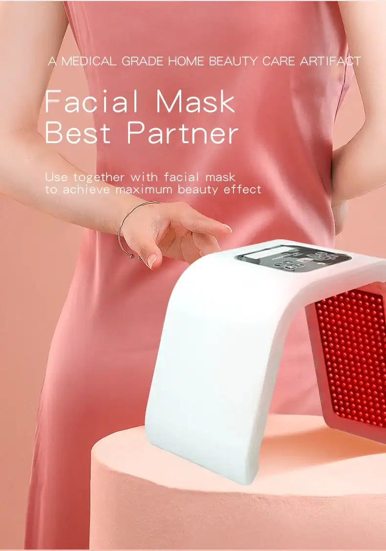 White LED light therapy facial device with a curved shape and red light panel on a pink display stand.