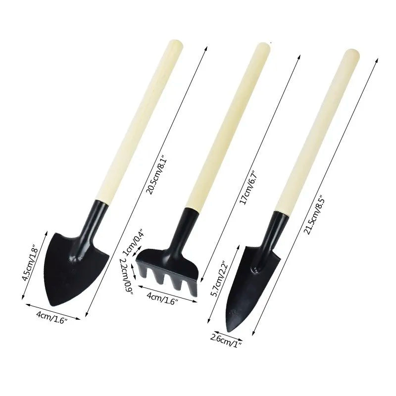 Set of mini gardening trowels with cream handles and black spades