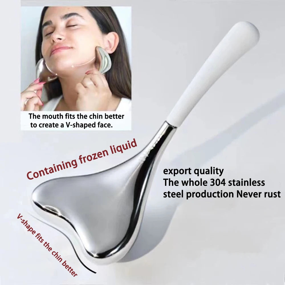 V-shaped stainless steel cryo gua sha tool with a white handle, shown in use on a woman’s chin.
