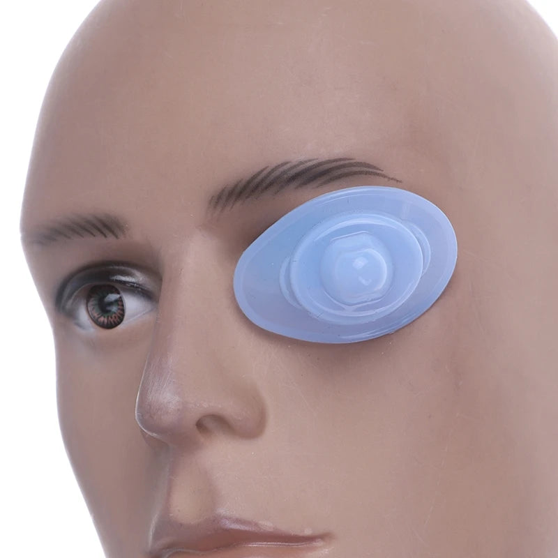 Reusable blue silicone eye wash cup positioned on a mannequin face for eye cleaning and hygiene.