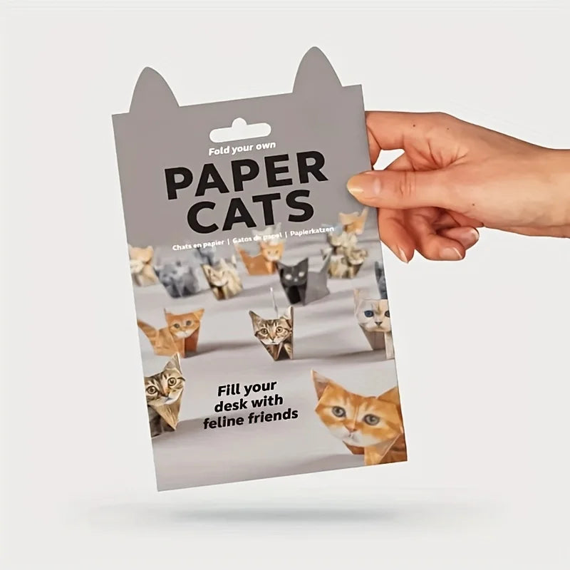 Hand holding a DIY Paper Cats origami kit, perfect for crafting cute handmade cat home decor and cat lover gifts.