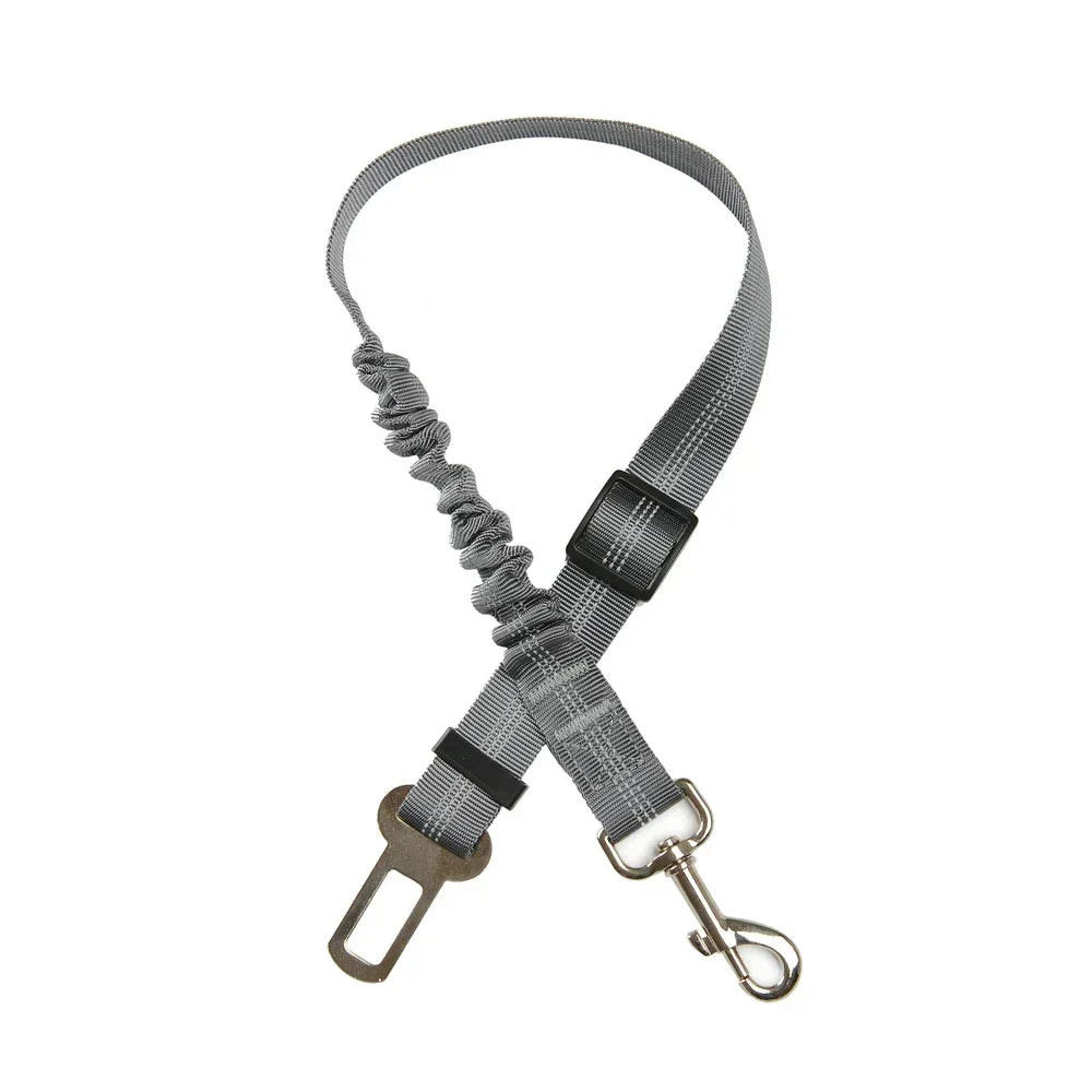 Adjustable grey reflective dog car seat belt with elastic shock-absorbing tether for safe pet travel.