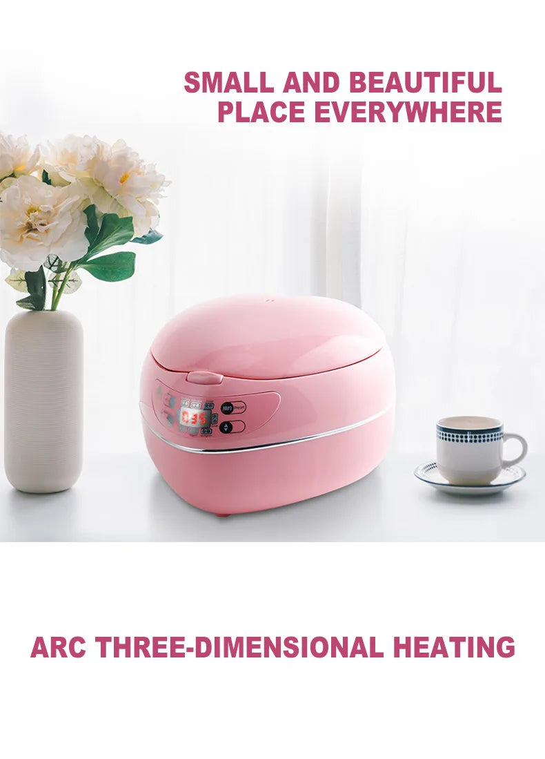 Pink heart-shaped rice cooker on table, front control panel visible