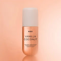 Vanilla Coconut hair and body fragrance mist in a cylindrical rose-gold bottle with a white cap.