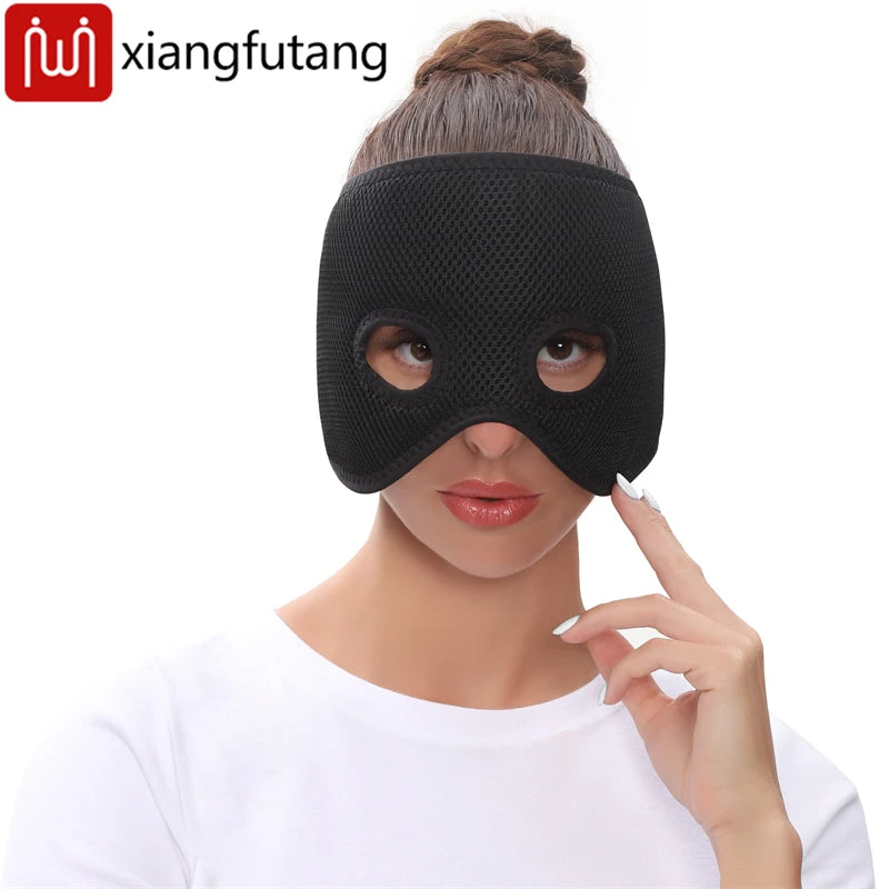 A person wearing a black, mesh-textured half-face heating mask with cutout eye holes.