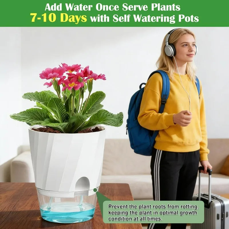 White self-watering planter pot with clear blue reservoir and pink flowers