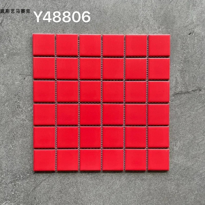 Ceramic mosaic wall tiles sheet with glossy red squares and dark grout lines