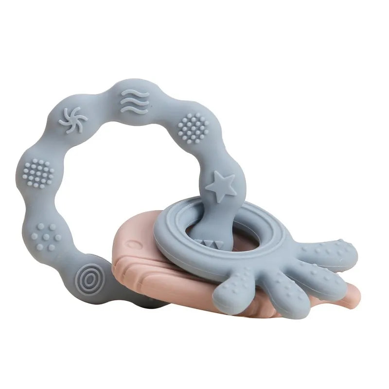 Blue and pink silicone baby teething rings for soothing gum relief.