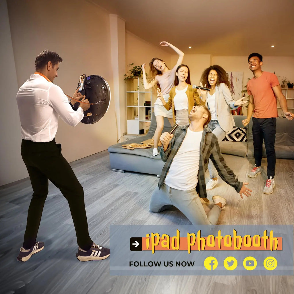 Handheld iPad photobooth with a round, black LED ring light being used to capture a group of people at a party.