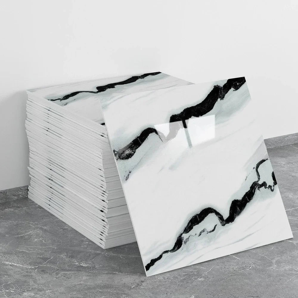 Marble peel-and-stick backsplash wall panel sheets in white with black ribbon veining