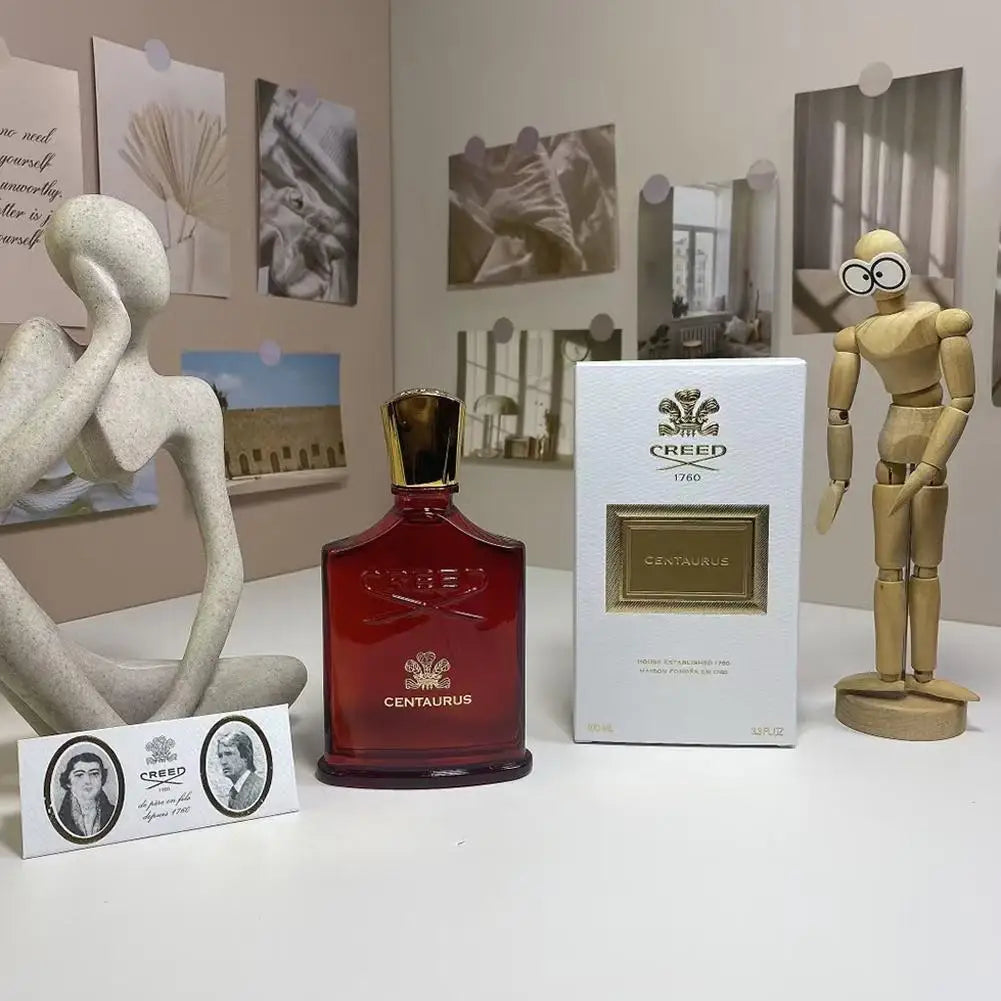 Creed Centaurus Eau de Parfum: A red glass luxury spray bottle for men and women, featuring gold accents and gift box.