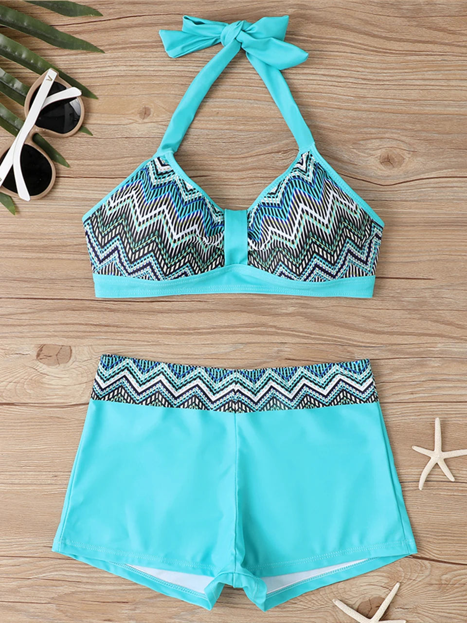 Tidesmit turquoise high-waisted bikini with a blue and black zigzag geometric print, halter top, and smooth fabric.