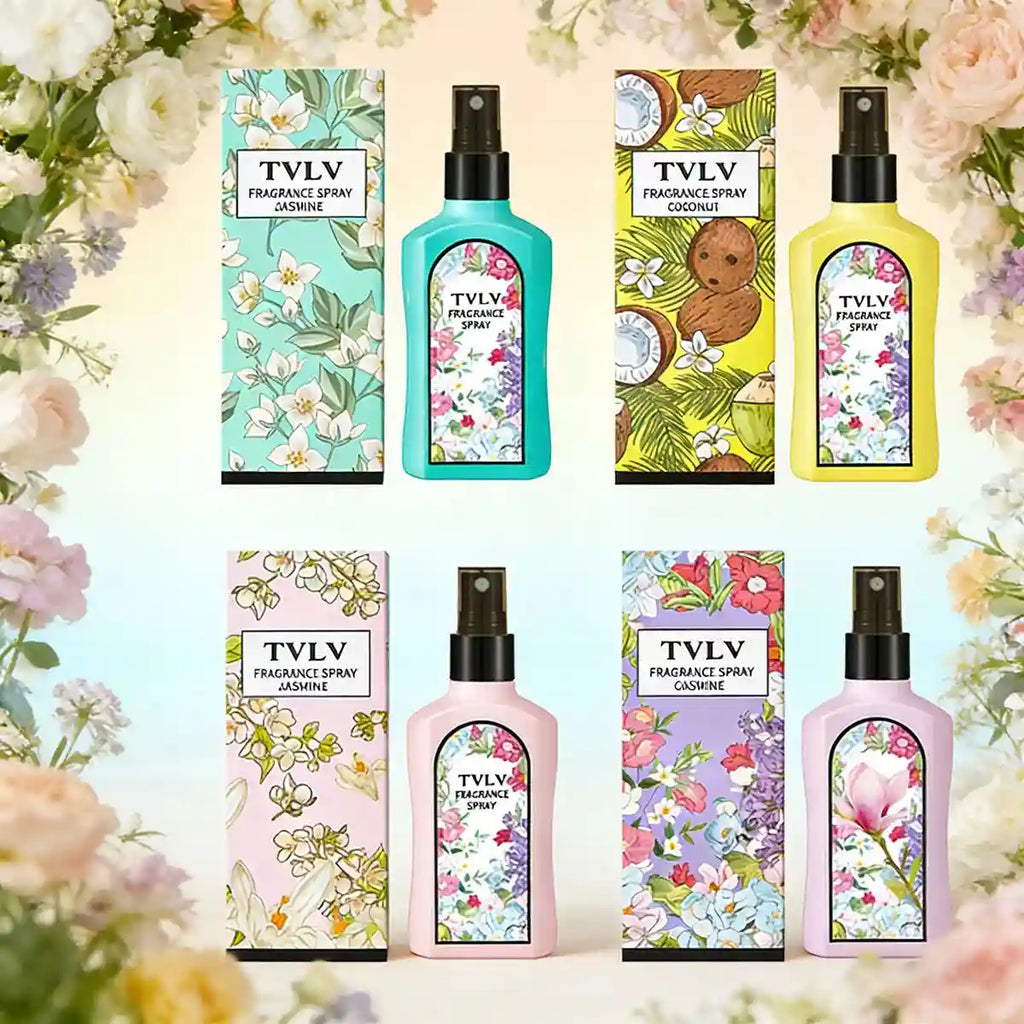 Four colorful fragrance spray bottles with matching floral boxes in teal, yellow, pink, and lilac against floral