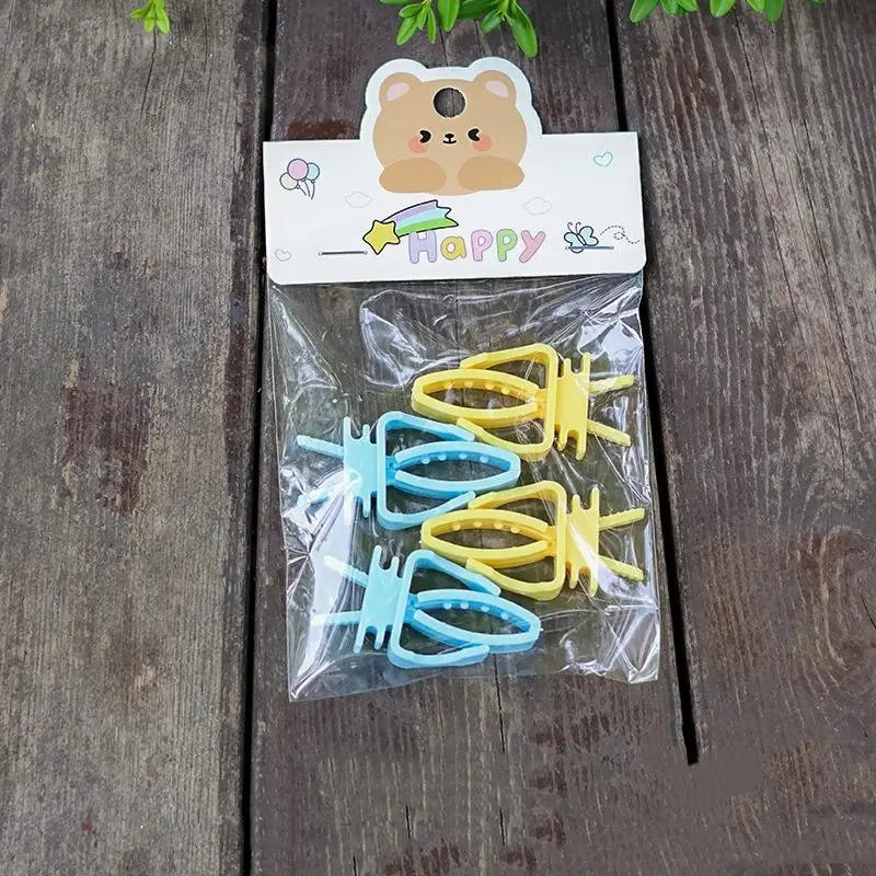 Set of 4 colorful plastic bird food clips for secure fruit, vegetable, or cuttlefish bone feeding in cages.