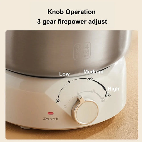 White electric cooking pot base with front control knob and heat-level indicators