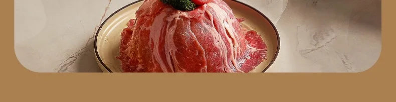 White electric cooking pot filled with raw meat and broth-ready contents