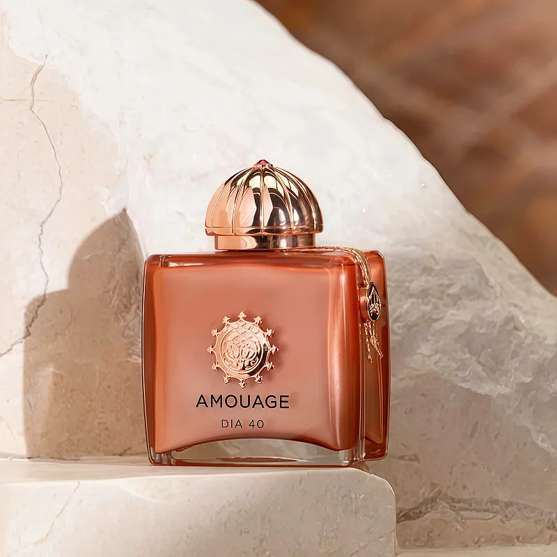Amouage Dia 40 Woman EDP, 100ml luxury floral woody oriental unisex perfume in a signature square copper glass bottle.