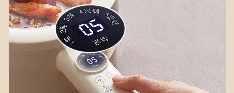 220V electric non-stick cooking pot control display showing heating and time settings