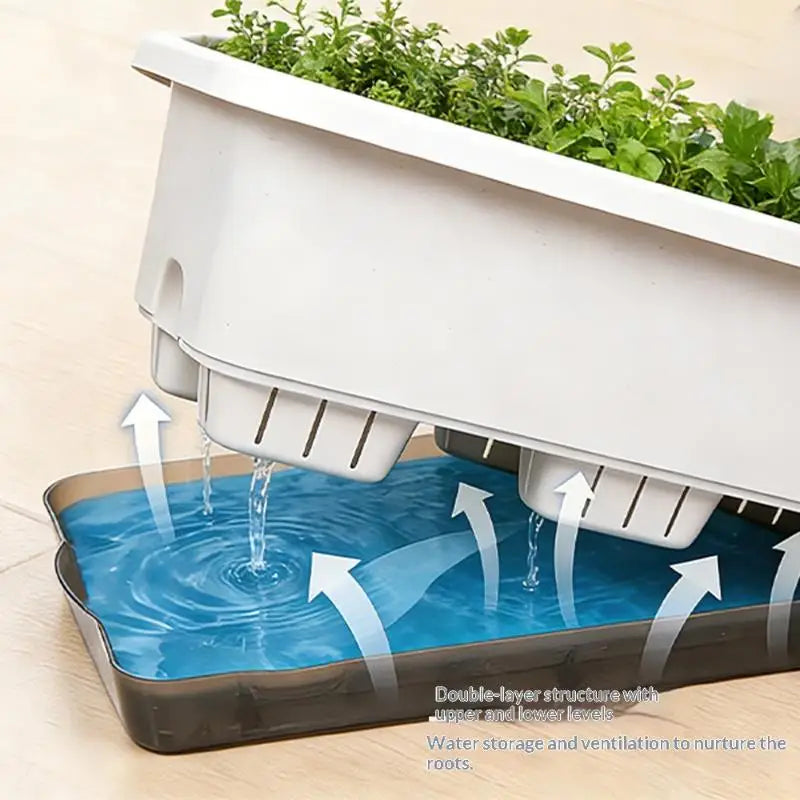 White self-watering planter with translucent blue water reservoir and inner water channel