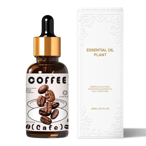 Coffee essential oil in amber glass bottle with gold dropper for natural aromatherapy wellness.