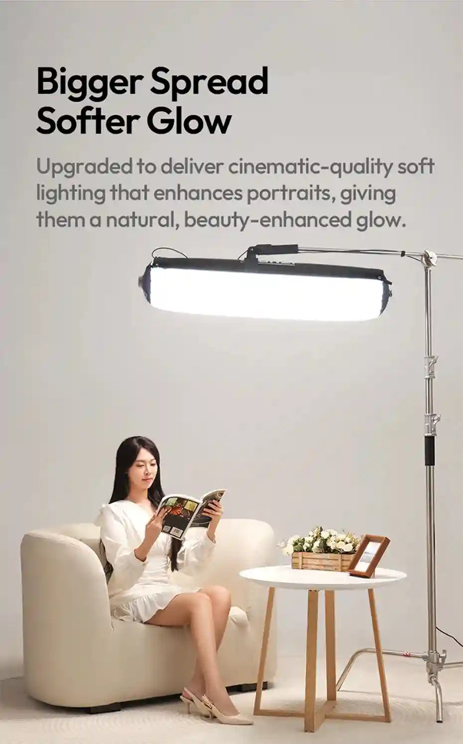 Large, rectangular LED softbox light on a silver metal floor stand, providing diffuse overhead lighting for portraiture.