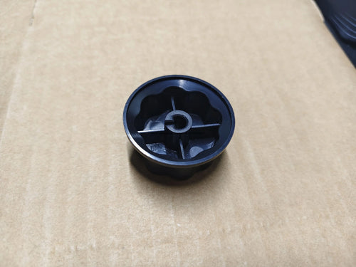 Black timer shift switch knob underside with circular indicator and cross slot