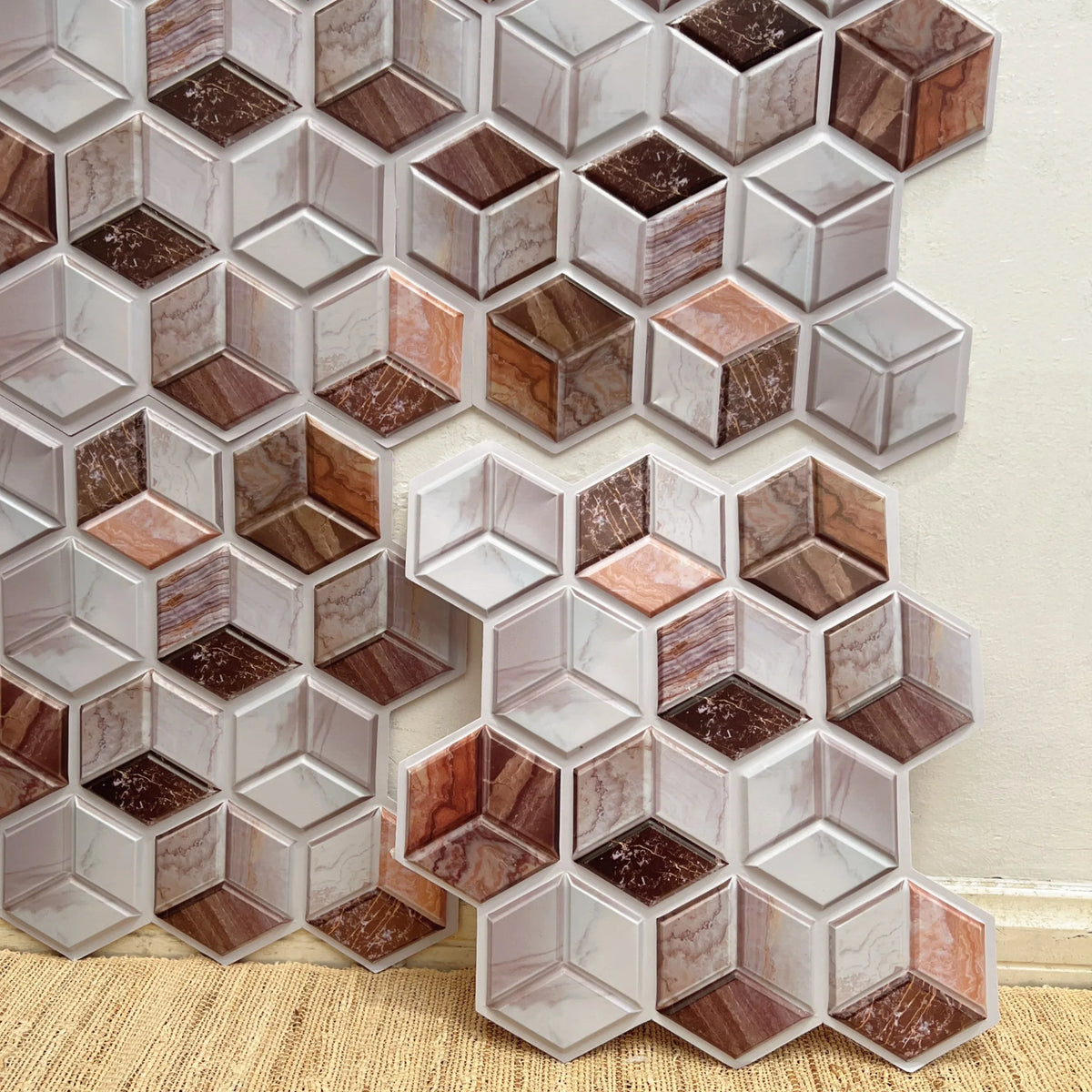Peel-and-stick backsplash tile sheet with hexagon mosaic pattern in white and brown wood tones